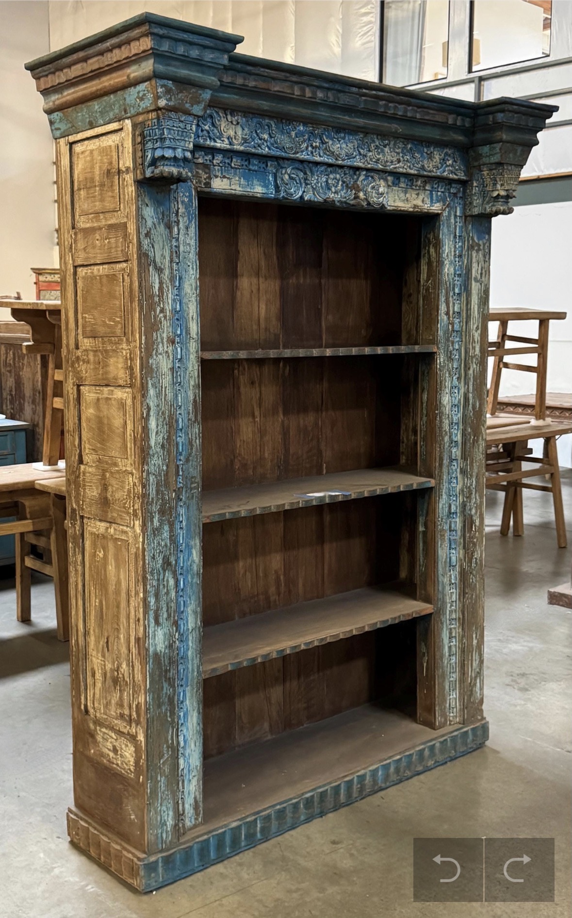 Large Blue Vintage Bookshelf with 3 shelves with decor overhang on top, left side view