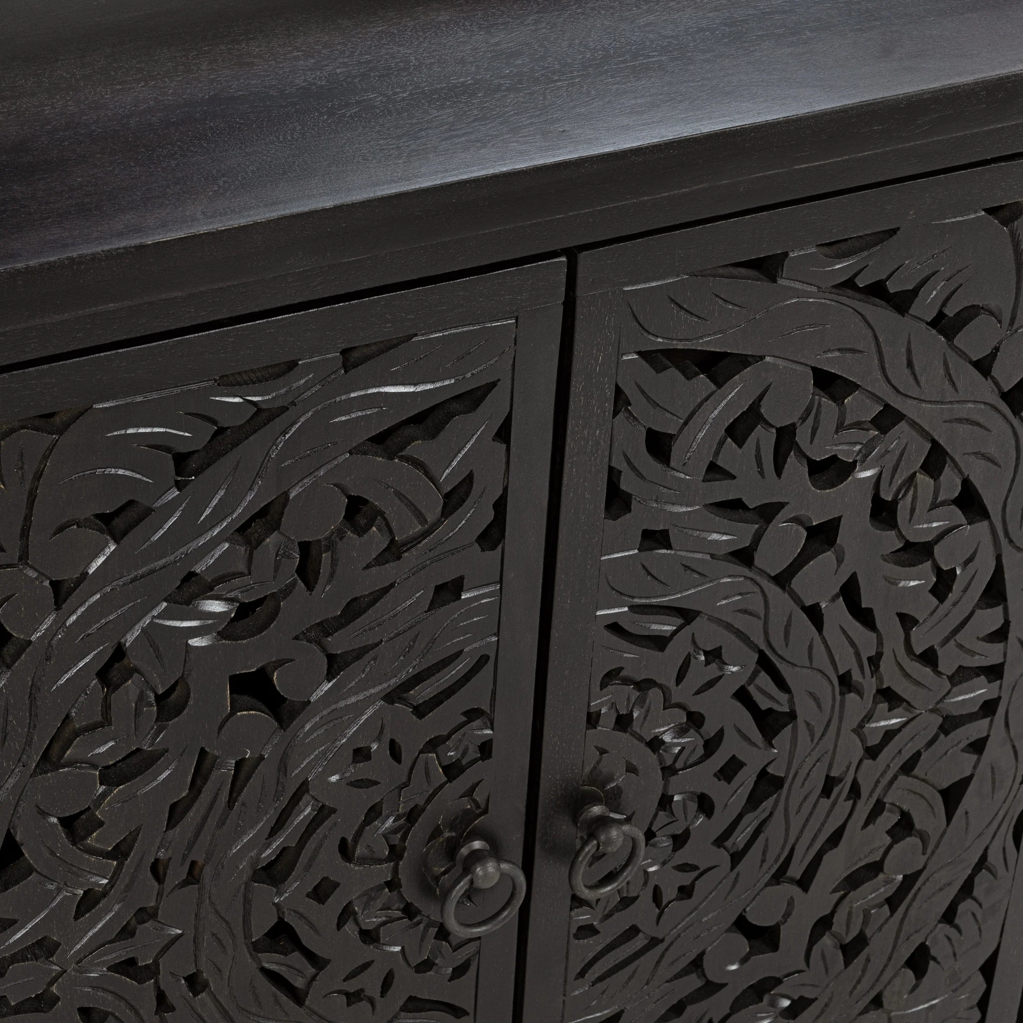 4-door mango wood Buffet in black, featuring intricately hand-carved floral panels that blend artistry with function. Door Detail