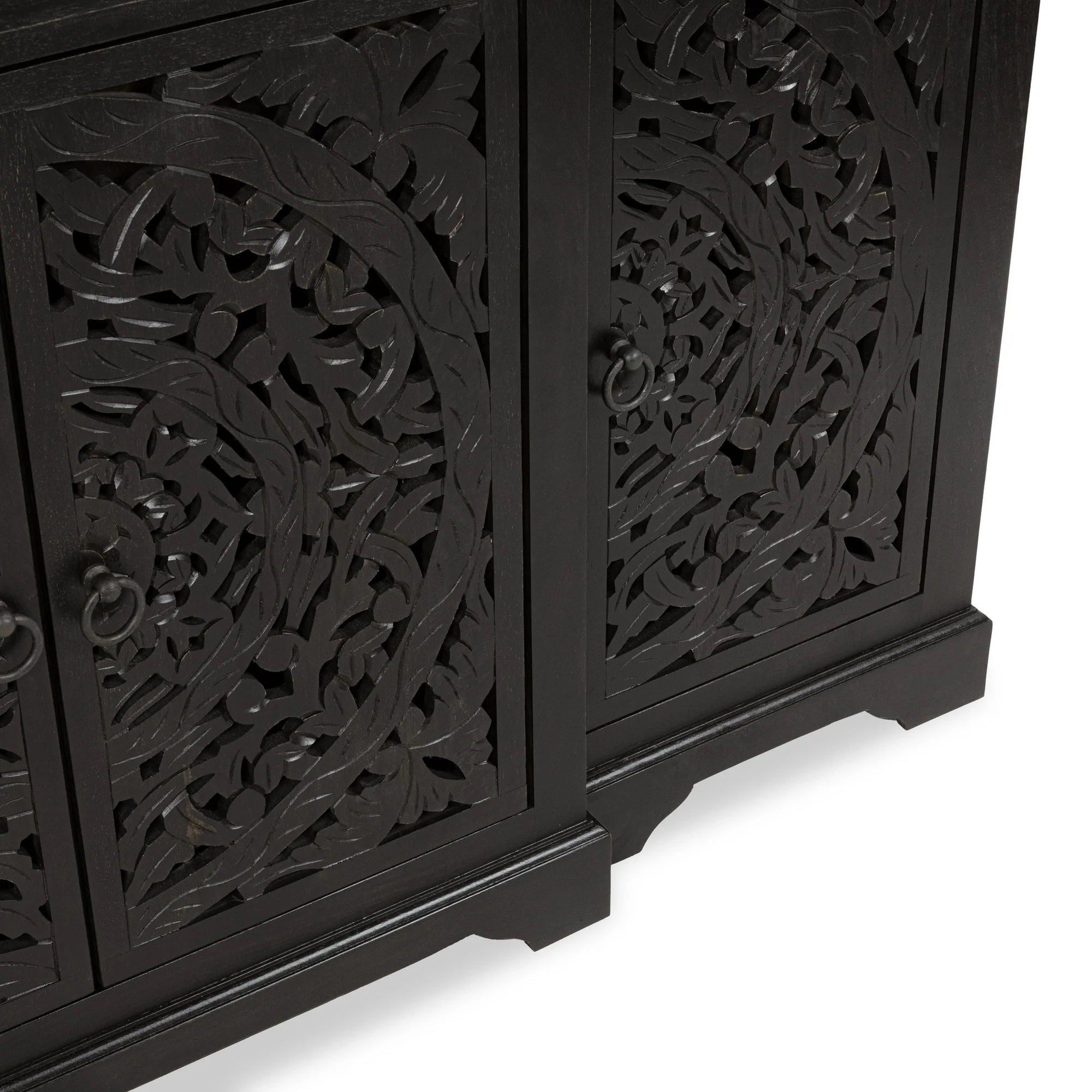 4-door mango wood Buffet in black, featuring intricately hand-carved floral panels that blend artistry with function, bottom corner view