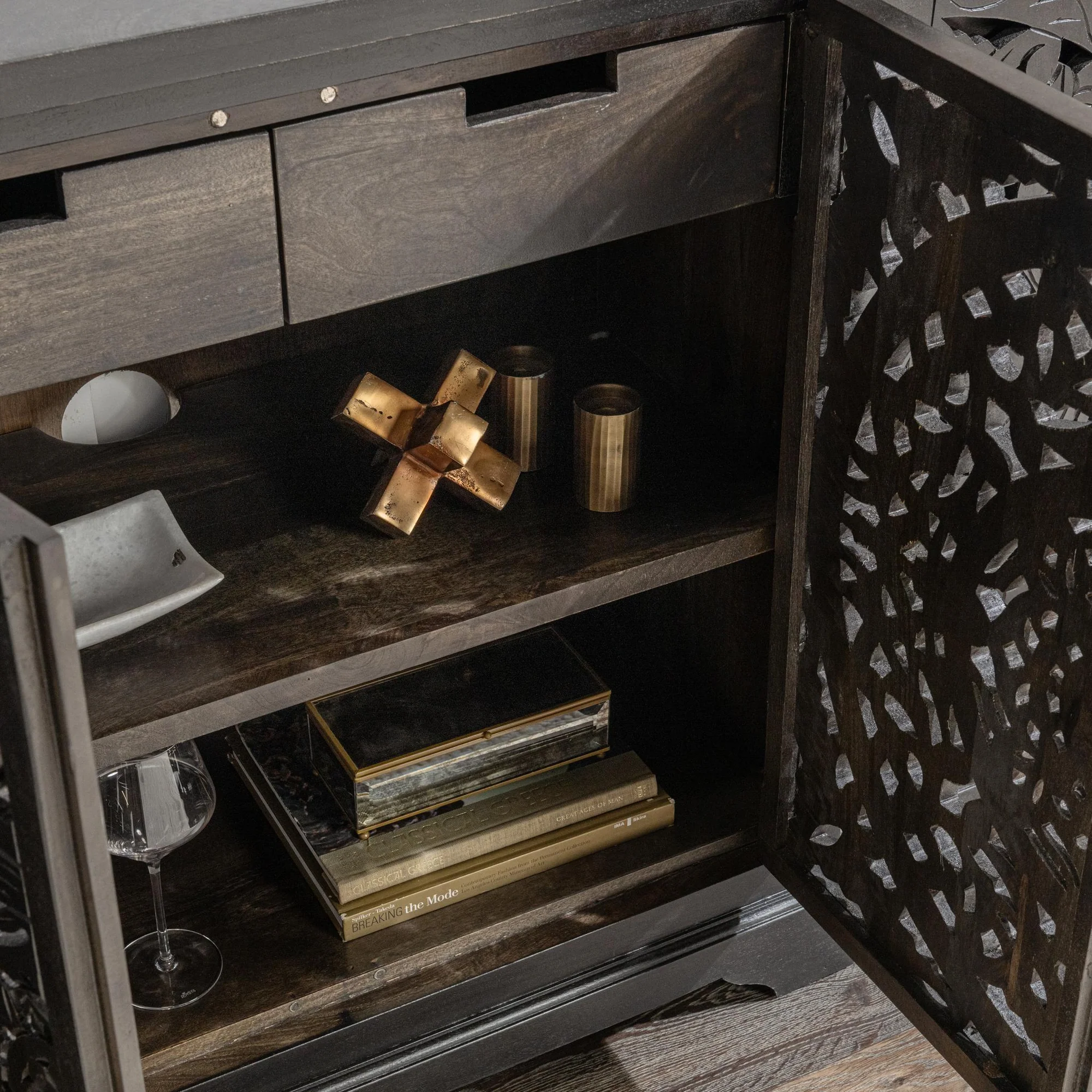 4-door mango wood Buffet in black, featuring intricately hand-carved floral panels that blend artistry with function. Open door detail
